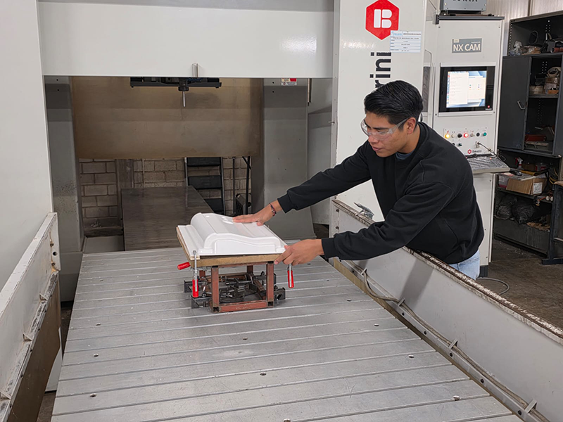 Technician working on a CNC machine